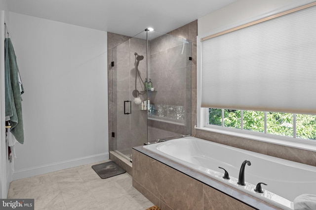 bathroom with separate shower and tub