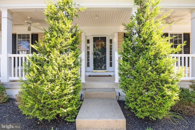 property entrance with a porch and ceiling fan