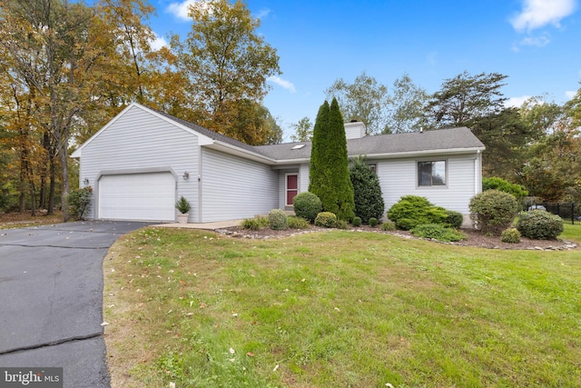 ranch-style house with a front lawn and a garage