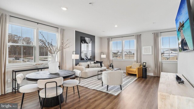 interior space featuring a wealth of natural light and dark hardwood / wood-style flooring