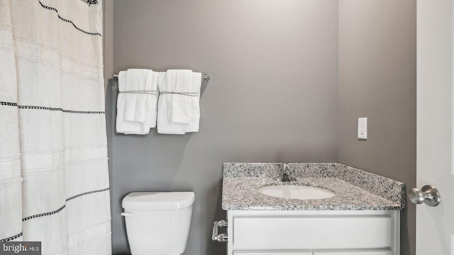 bathroom with vanity and toilet