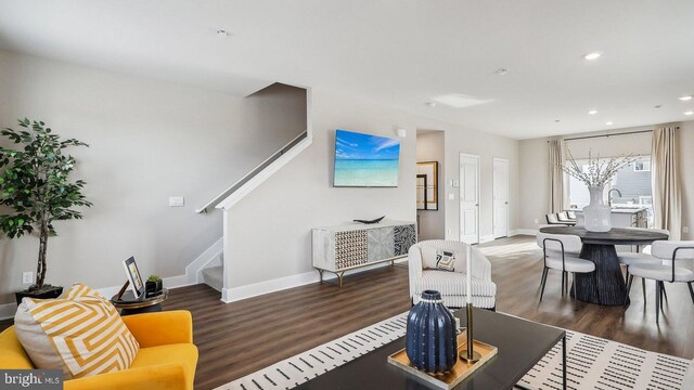 living room featuring dark hardwood / wood-style floors