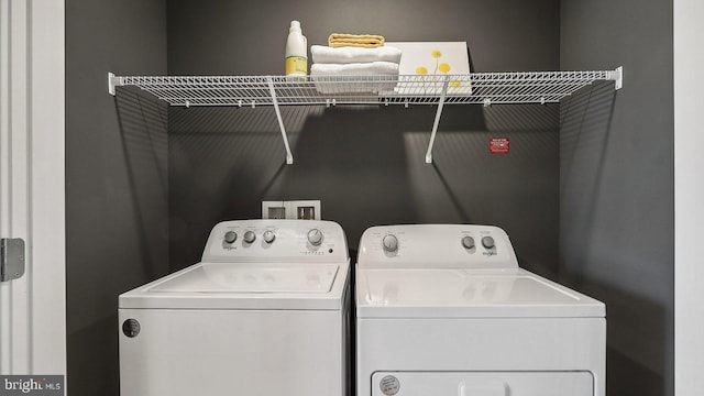 laundry room featuring separate washer and dryer