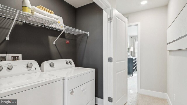 laundry room with separate washer and dryer