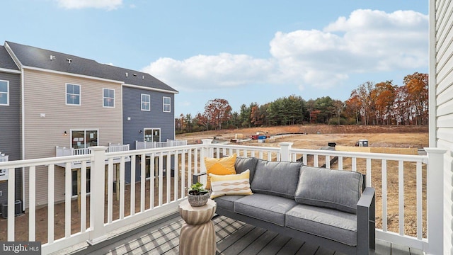 wooden deck with outdoor lounge area