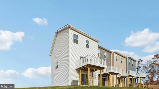 back of property with a wooden deck