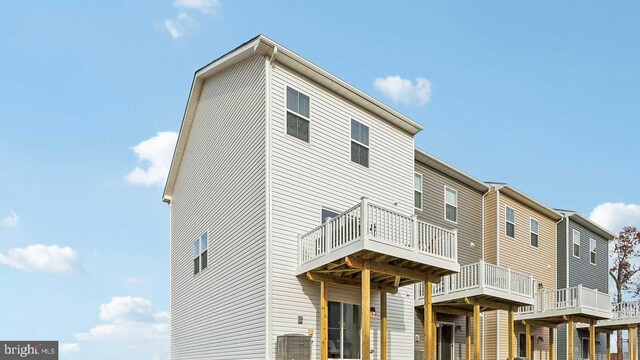 rear view of property with a wooden deck