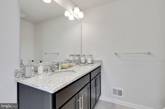 bathroom with vanity and tile patterned flooring