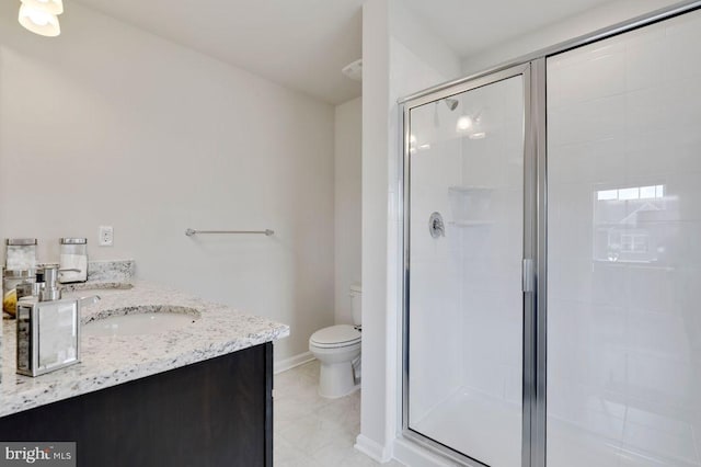 bathroom with a shower with door, vanity, and toilet