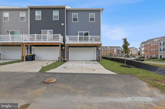 back of property with a garage