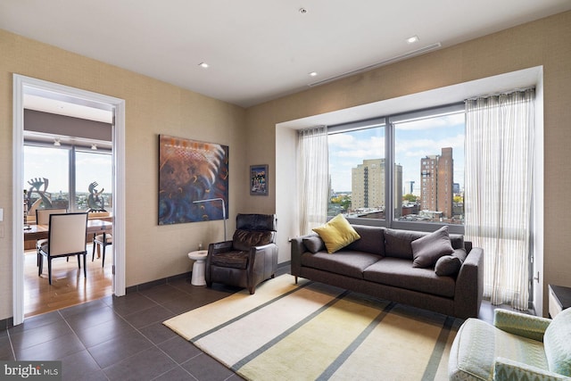 living room featuring dark tile patterned flooring