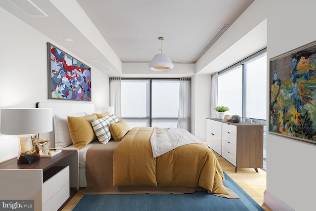 bedroom with light wood-type flooring