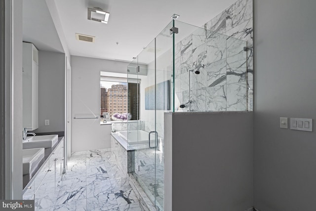 bathroom featuring vanity and shower with separate bathtub