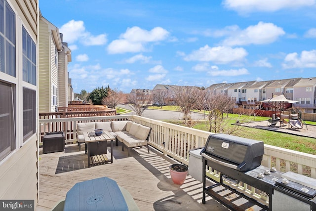 view of patio with a wooden deck, a grill, a residential view, and an outdoor hangout area