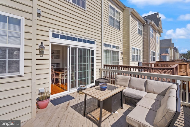 wooden terrace featuring outdoor lounge area