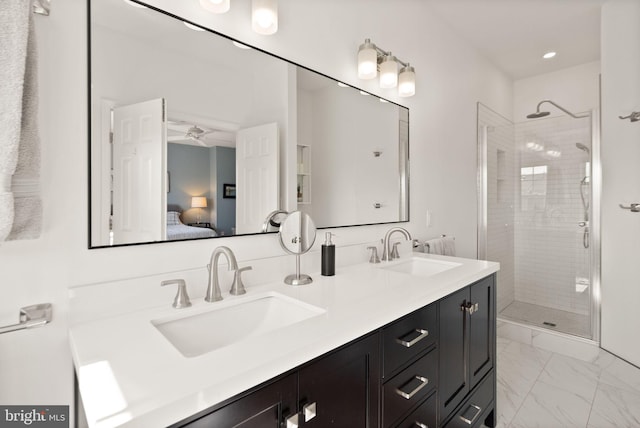 bathroom featuring a shower stall, marble finish floor, and a sink