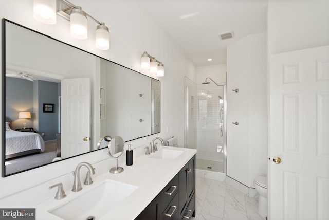 full bath with marble finish floor, toilet, a shower stall, and a sink