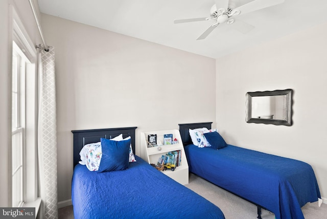 carpeted bedroom with a ceiling fan