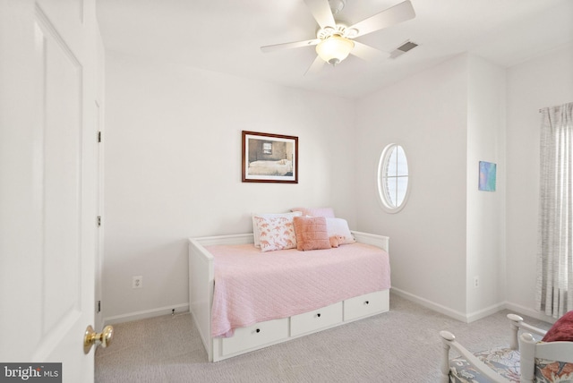 carpeted bedroom with visible vents, ceiling fan, and baseboards