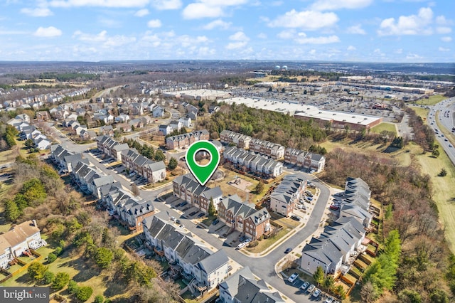 birds eye view of property with a residential view