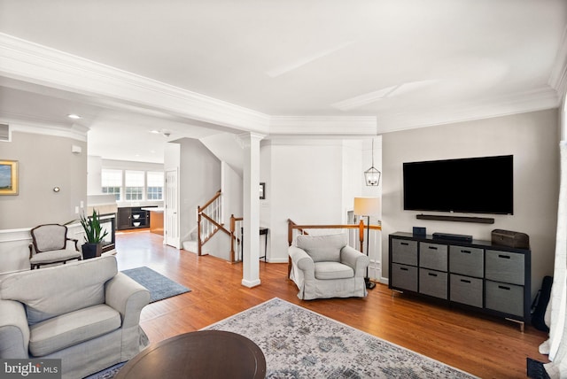 living room featuring wood finished floors and ornamental molding