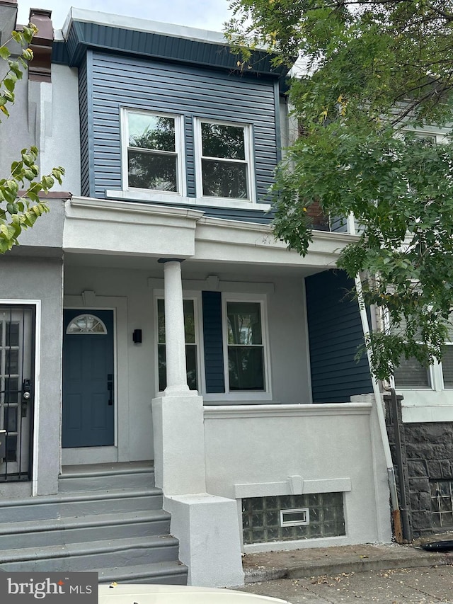 entrance to property with a porch