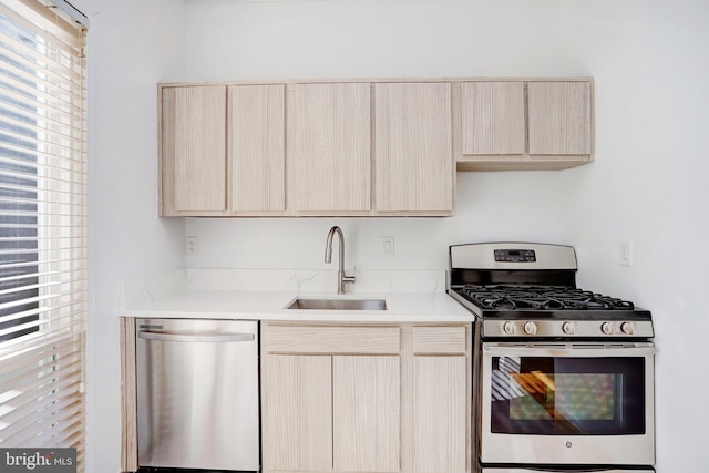 kitchen with stainless steel appliances, a wealth of natural light, and light brown cabinetry