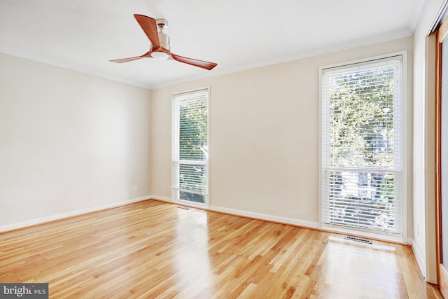 unfurnished room with ceiling fan, ornamental molding, and light hardwood / wood-style flooring