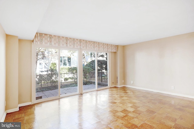 unfurnished room with light parquet floors