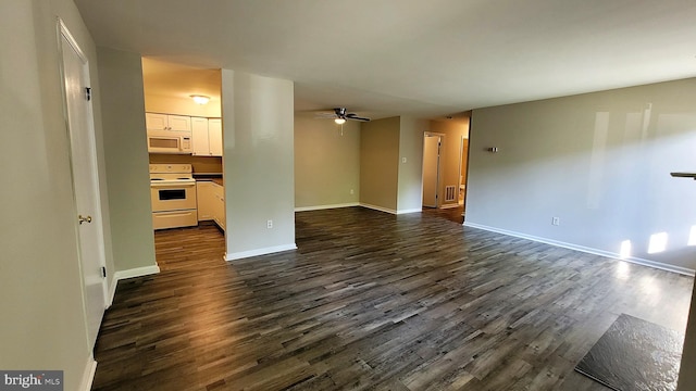 unfurnished living room featuring dark hardwood / wood-style floors and ceiling fan