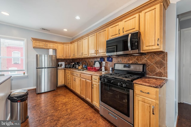 kitchen with decorative backsplash, dark stone countertops, dark wood-type flooring, stainless steel appliances, and crown molding