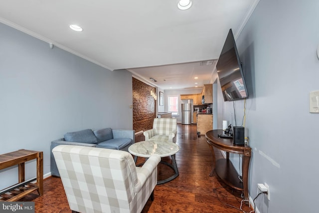 living room with brick wall, ornamental molding, and dark wood-type flooring