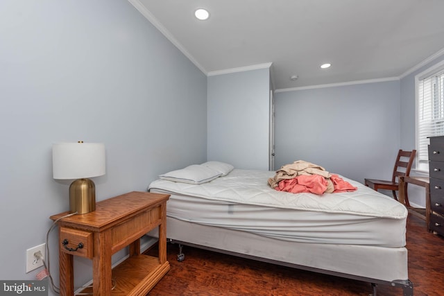 bedroom featuring dark hardwood / wood-style floors and crown molding