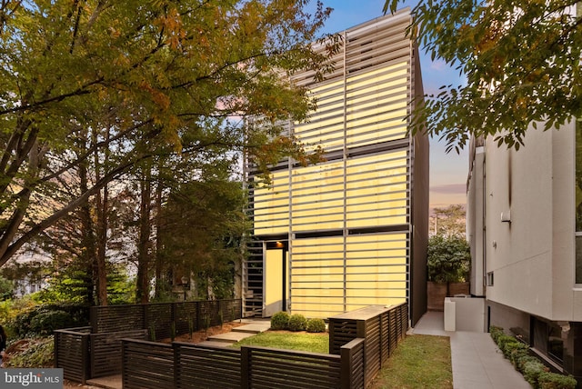 view of property exterior at dusk