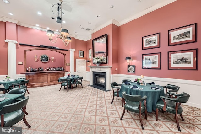 dining room featuring ornamental molding and a notable chandelier