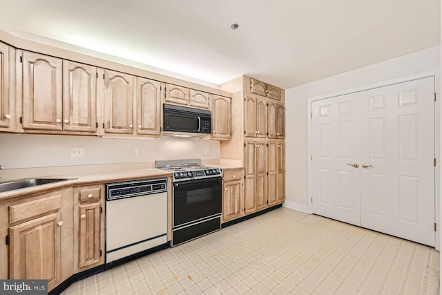 kitchen with white dishwasher, light brown cabinets, range with electric stovetop, and sink