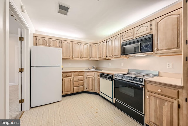 kitchen featuring white appliances, light brown cabinets, and sink