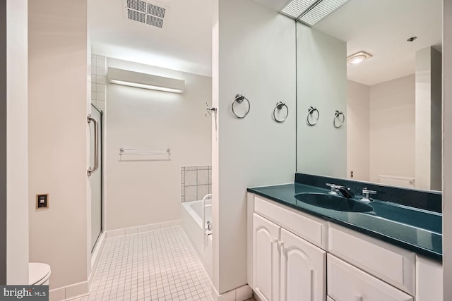 full bathroom with vanity, shower with separate bathtub, toilet, and tile patterned floors