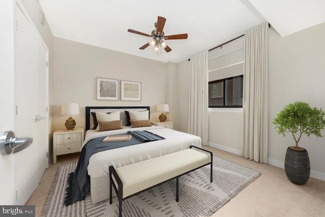 carpeted bedroom with ceiling fan