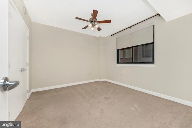 carpeted empty room with ceiling fan