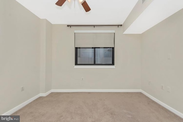 empty room featuring light carpet and ceiling fan