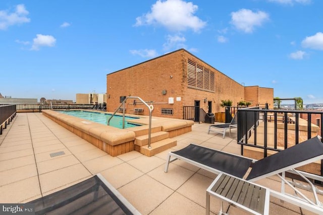 view of swimming pool featuring a patio