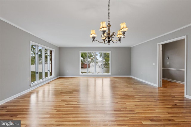 interior space featuring light wood-type flooring, a healthy amount of sunlight, and crown molding