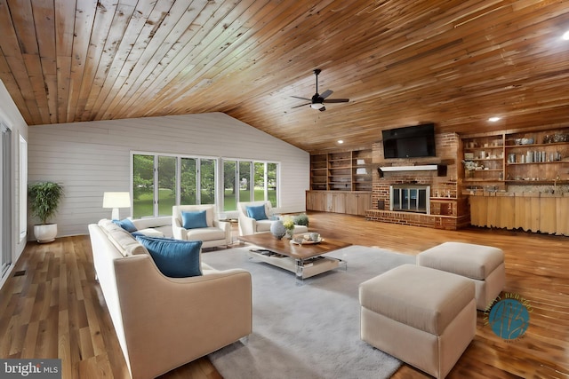 living room with wooden ceiling, wood-type flooring, lofted ceiling, built in features, and wooden walls