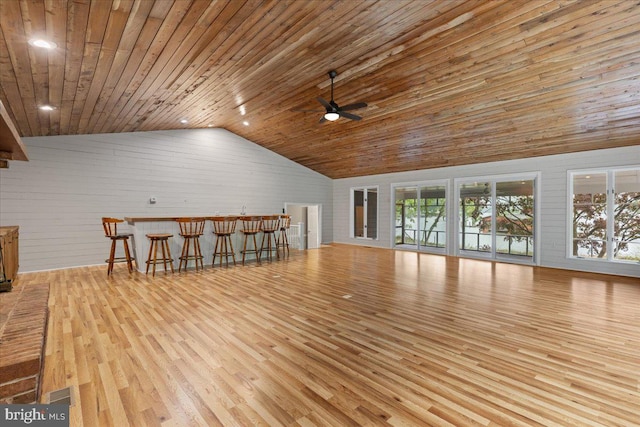 interior space with light hardwood / wood-style flooring, high vaulted ceiling, wooden ceiling, and ceiling fan