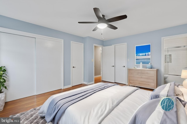 bedroom with light wood-type flooring, ensuite bath, and ceiling fan