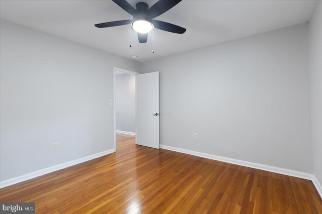 empty room with wood-type flooring and ceiling fan