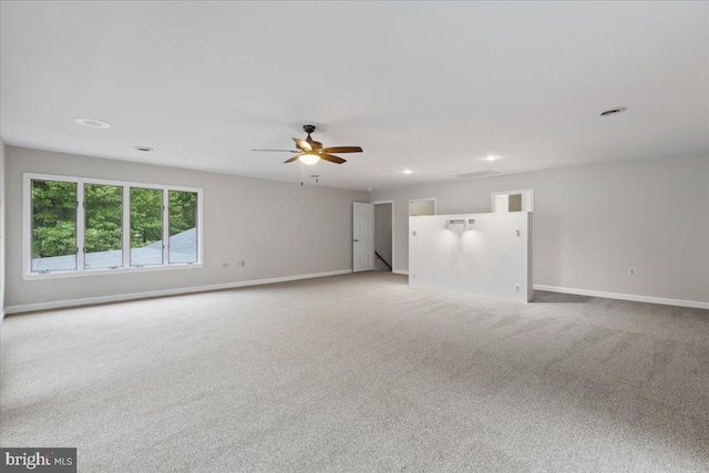 empty room featuring carpet and ceiling fan