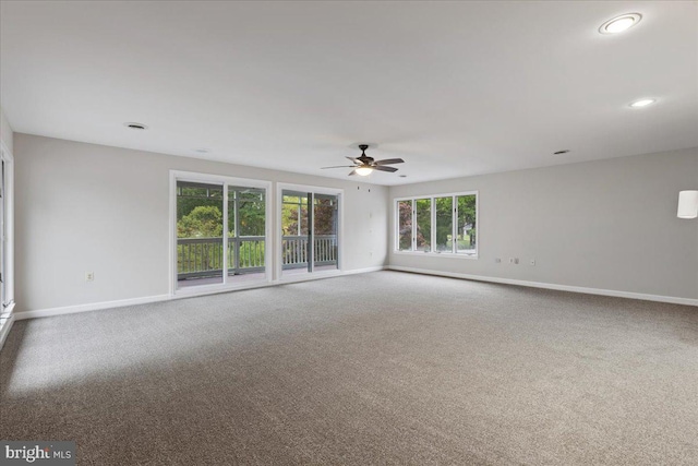 carpeted empty room with ceiling fan