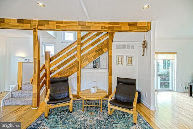 sitting room with wood-type flooring